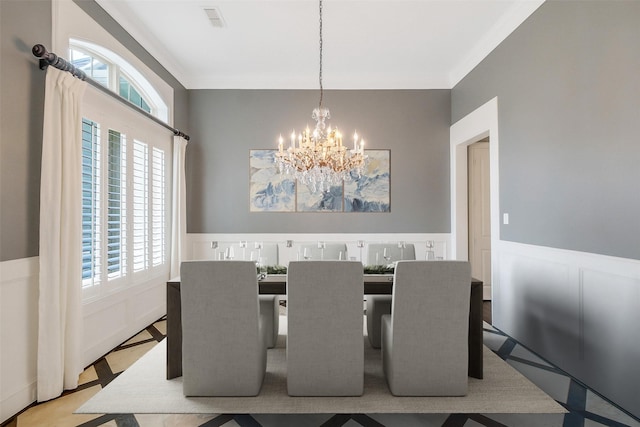 1518 Hillendahl Blvd, Houston, TX 77055 - dining area with a chandelier, wainscoting, and ornamental molding