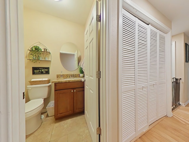 40 Dartmoor Ct, Coldspring, TX 77331 - bathroom with toilet, vanity, and a closet