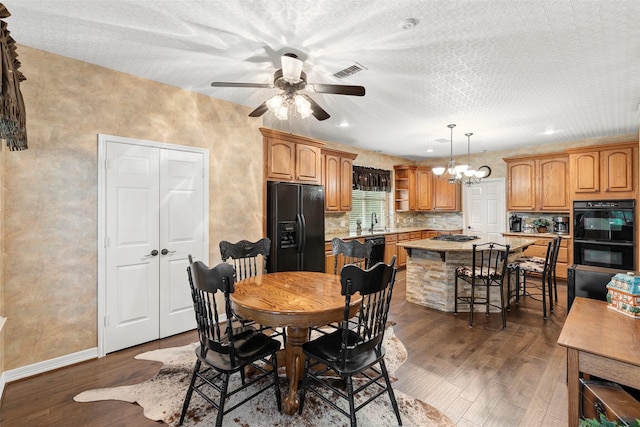 3602 Blue Lake Dr, Spring, TX 77388 - dining area featuring dark wood-style flooring, a ceiling fan, baseboards, a chandelier, and recessed lighting