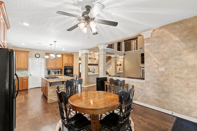 3602 Blue Lake Dr, Spring, TX 77388 - dining space featuring ceiling fan, dark wood finished floors, baseboards, ornate columns, and recessed lighting