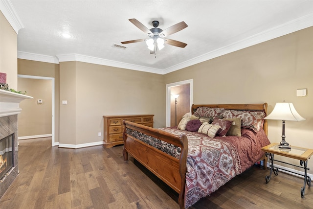 3602 Blue Lake Dr, Spring, TX 77388 - bedroom with a fireplace, baseboards, wood finished floors, crown molding, and ceiling fan