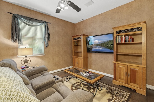 3602 Blue Lake Dr, Spring, TX 77388 - living area featuring dark wood-type flooring, baseboards, and a ceiling fan