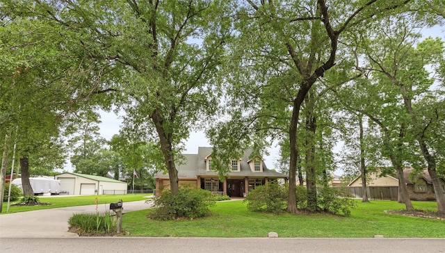 3602 Blue Lake Dr, Spring, TX 77388 - view of front facade with a detached garage, an outdoor structure, and driveway
