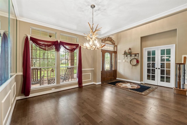 3602 Blue Lake Dr, Spring, TX 77388 - entrance foyer with a chandelier, french doors, ornamental molding, and wood finished floors