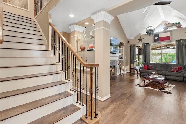 3602 Blue Lake Dr, Spring, TX 77388 - stairway with wood finished floors, a ceiling fan, high vaulted ceiling, baseboards, and recessed lighting