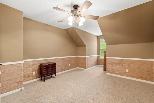3602 Blue Lake Dr, Spring, TX 77388 - additional living space with a ceiling fan, vaulted ceiling, carpet, and a wainscoted wall