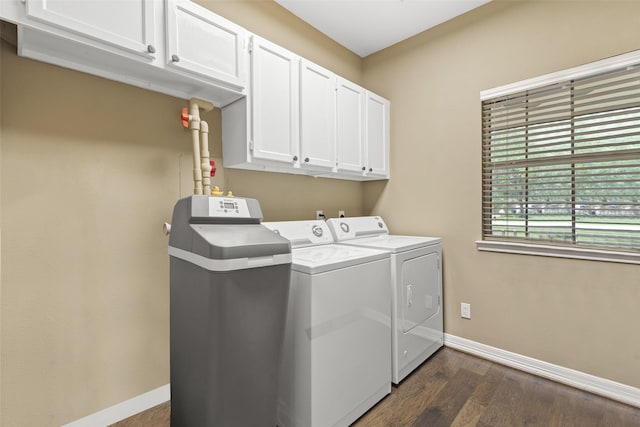 3602 Blue Lake Dr, Spring, TX 77388 - washroom featuring washing machine and dryer, cabinet space, baseboards, and dark wood finished floors