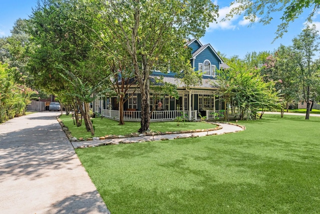 2474 Ripplewood Ct, Conroe, TX 77384 - view of property hidden behind natural elements featuring a front yard and a porch