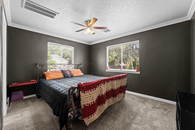 2474 Ripplewood Ct, Conroe, TX 77384 - carpeted bedroom with ornamental molding, baseboards, ceiling fan, and a textured ceiling