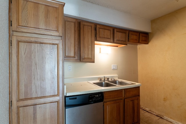 1860 White Oak Dr Unit 333, Houston, TX 77009 - kitchen with dishwasher, a sink, light countertops, and brown cabinetry