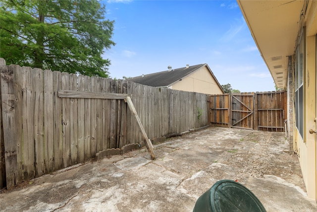 11818 Guadalupe River Dr, Houston, TX 77067 - view of patio / terrace featuring a gate