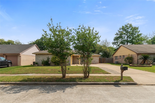 11818 Guadalupe River Dr, Houston, TX 77067 - view of front facade featuring concrete driveway and brick siding