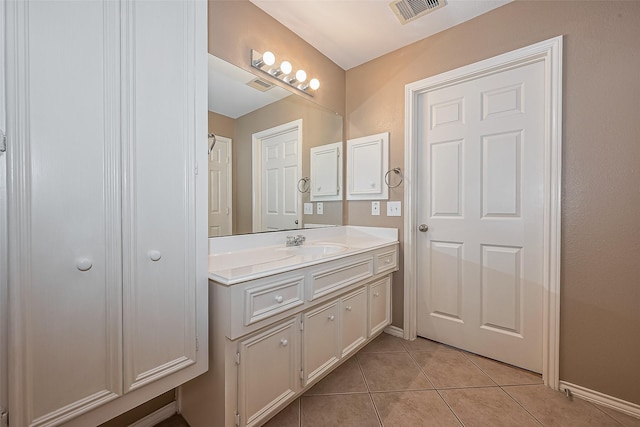 16715 Red Falls Cir, Houston, TX 77095 - bathroom with vanity, tile patterned flooring, and baseboards