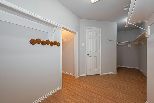 16715 Red Falls Cir, Houston, TX 77095 - walk in closet featuring light wood-style floors