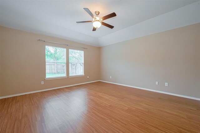16715 Red Falls Cir, Houston, TX 77095 - empty room featuring light wood finished floors, a ceiling fan, and baseboards