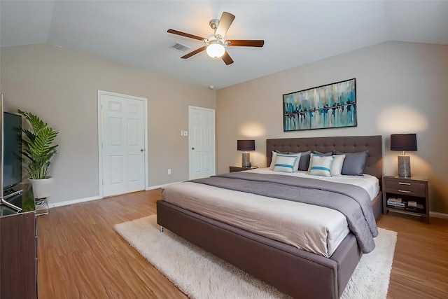 16715 Red Falls Cir, Houston, TX 77095 - bedroom featuring vaulted ceiling, light wood-type flooring, baseboards, and ceiling fan