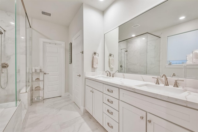 2818 Grand Fountains Dr Unit C, Houston, TX 77054 - bathroom featuring a marble finish shower, marble finish flooring, double vanity, baseboards, and recessed lighting
