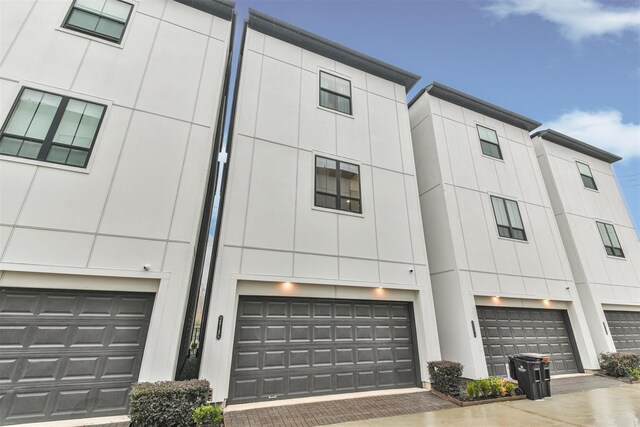 2818 Grand Fountains Dr Unit C, Houston, TX 77054 - view of property with an attached garage and driveway
