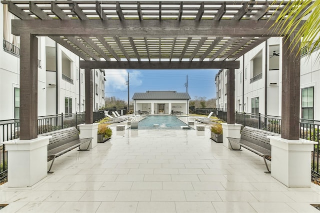2818 Grand Fountains Dr Unit C, Houston, TX 77054 - view of patio with an outbuilding, a pergola, a community pool, and a storage structure