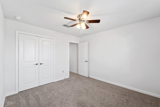 5411 Cavall Rd, Missouri City, TX 77459 - unfurnished bedroom featuring carpet flooring, a closet, baseboards, and a ceiling fan