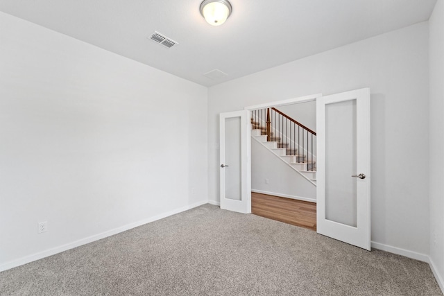 5411 Cavall Rd, Missouri City, TX 77459 - carpeted spare room with stairway, baseboards, and french doors
