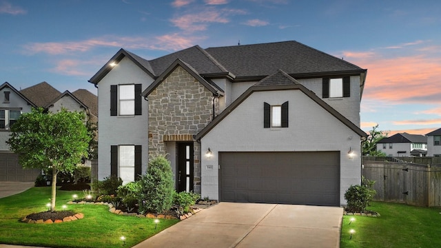 5411 Cavall Rd, Missouri City, TX 77459 - french provincial home with stone siding, driveway, a garage, and a shingled roof