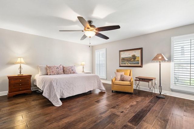 15726 Steamboat Ln, Houston, TX 77079 - bedroom with multiple windows, hardwood / wood-style floors, baseboards, and a ceiling fan