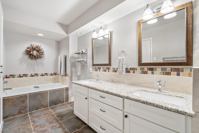 15726 Steamboat Ln, Houston, TX 77079 - full bath featuring double vanity, a garden tub, tile patterned flooring, recessed lighting, and tasteful backsplash