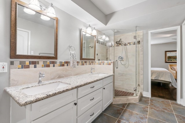 15726 Steamboat Ln, Houston, TX 77079 - bathroom featuring double vanity, a stall shower, tile patterned floors, and connected bathroom