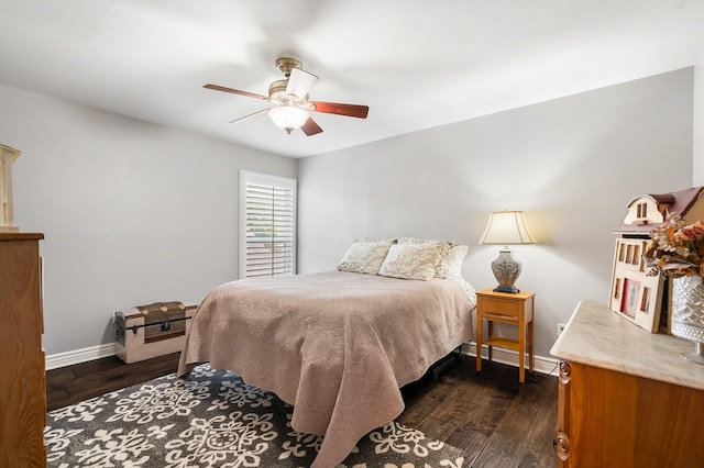 15726 Steamboat Ln, Houston, TX 77079 - bedroom with dark wood-type flooring, baseboards, and a ceiling fan