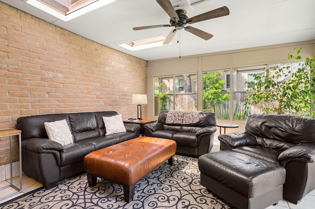 15726 Steamboat Ln, Houston, TX 77079 - living area featuring a skylight, a ceiling fan, and brick wall
