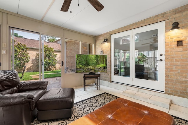 15726 Steamboat Ln, Houston, TX 77079 - sunroom / solarium with brick wall, ceiling fan, tile patterned floors, and french doors