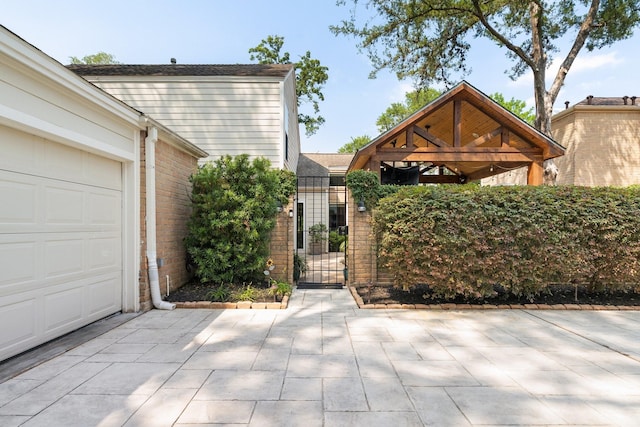 15726 Steamboat Ln, Houston, TX 77079 - view of front of property with brick siding, a garage, and a gazebo