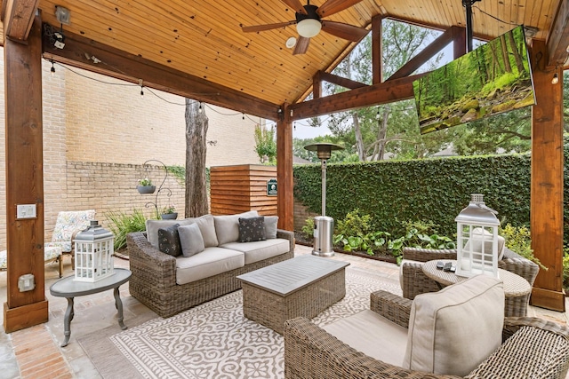 15726 Steamboat Ln, Houston, TX 77079 - fenced backyard featuring a ceiling fan, an outdoor living space, and a gazebo