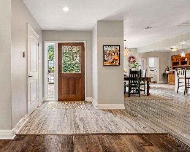 15726 Steamboat Ln, Houston, TX 77079 - entrance foyer featuring baseboards, wood finished floors, recessed lighting, and a chandelier
