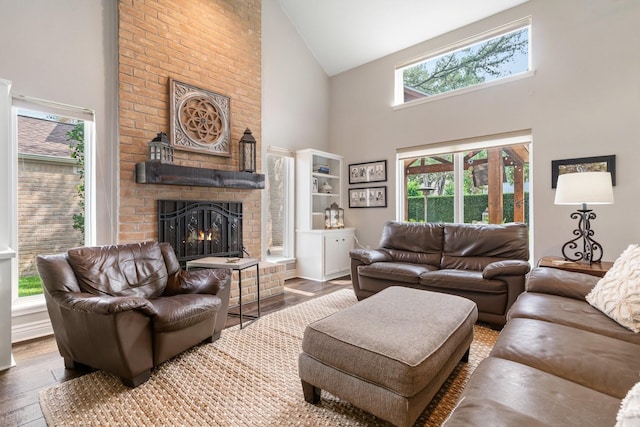 15726 Steamboat Ln, Houston, TX 77079 - living room featuring high vaulted ceiling, a brick fireplace, hardwood / wood-style floors, and healthy amount of natural light