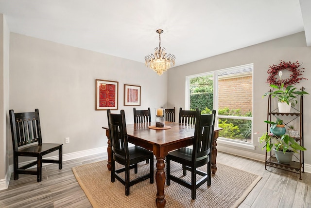 15726 Steamboat Ln, Houston, TX 77079 - dining space featuring baseboards, a chandelier, and light wood-style floors