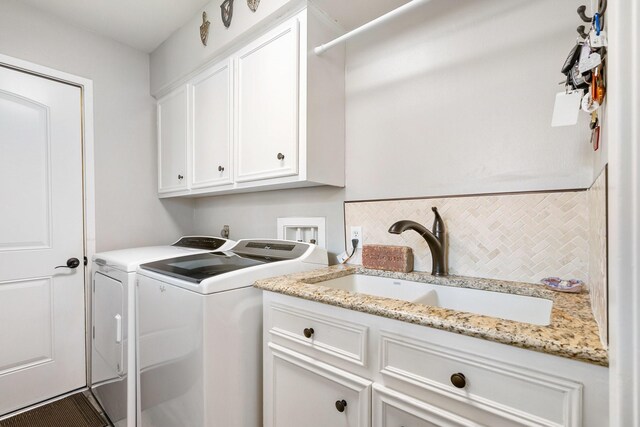 15726 Steamboat Ln, Houston, TX 77079 - laundry area with washer and clothes dryer and cabinet space