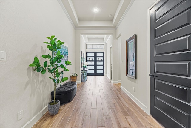 21511 Blue Porterweed Trl, Cypress, TX 77433 - foyer with light wood-style floors, a raised ceiling, and baseboards