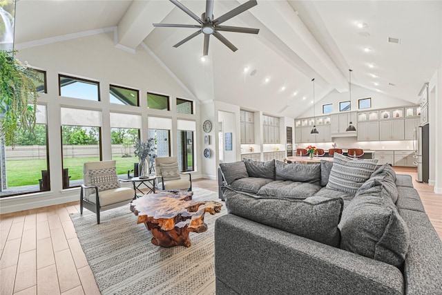 21511 Blue Porterweed Trl, Cypress, TX 77433 - living room featuring beamed ceiling, light wood-style flooring, ceiling fan, high vaulted ceiling, and healthy amount of natural light