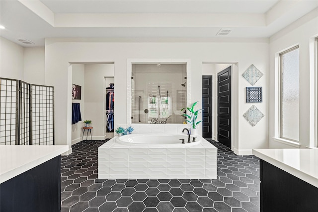 21511 Blue Porterweed Trl, Cypress, TX 77433 - bathroom with vanity, tile patterned flooring, a bath, and a spacious closet