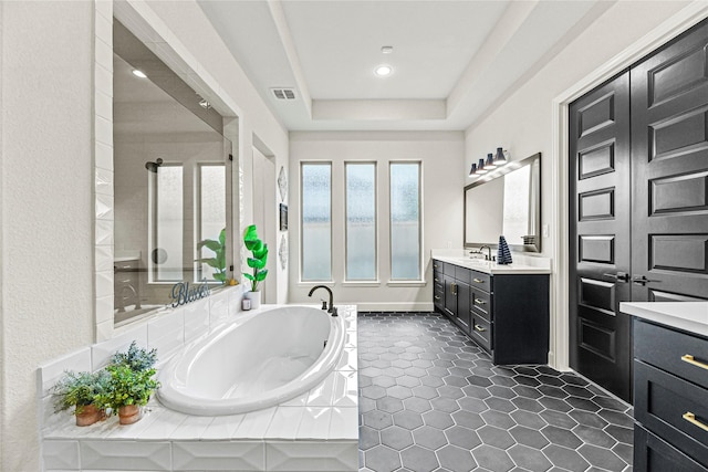 21511 Blue Porterweed Trl, Cypress, TX 77433 - full bath with vanity, a garden tub, a shower stall, tile patterned flooring, and recessed lighting