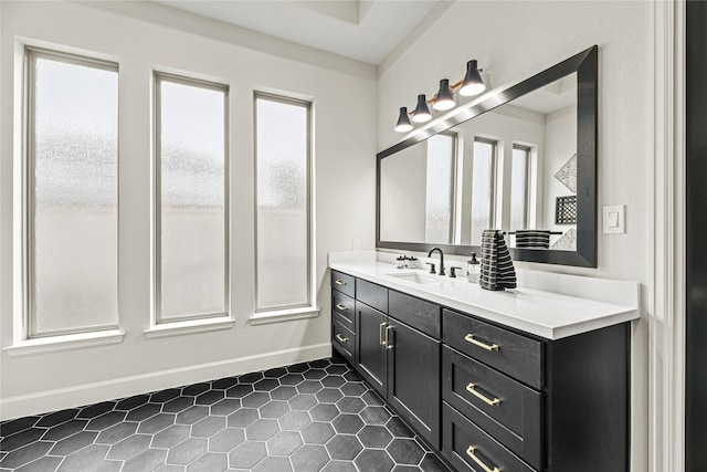 21511 Blue Porterweed Trl, Cypress, TX 77433 - bathroom with baseboards, tile patterned flooring, and vanity