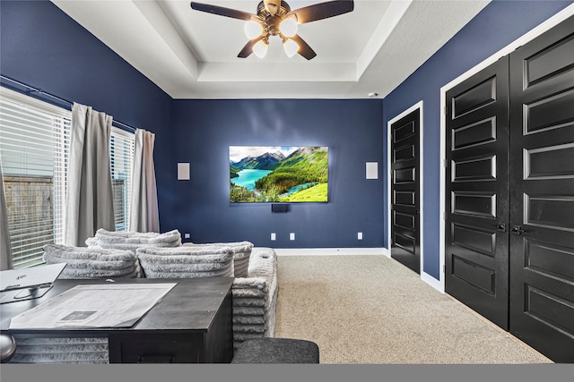 21511 Blue Porterweed Trl, Cypress, TX 77433 - carpeted cinema room with a ceiling fan and a tray ceiling