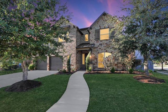 30702 Barred Owl Way, Brookshire, TX 77423 - view of front of house with driveway, a yard, stone siding, and an attached garage
