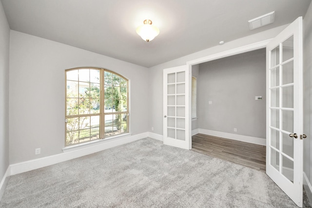 30702 Barred Owl Way, Brookshire, TX 77423 - unfurnished room with french doors, baseboards, and carpet