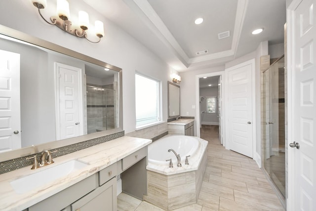 30702 Barred Owl Way, Brookshire, TX 77423 - full bath featuring a shower stall, a garden tub, two vanities, and recessed lighting
