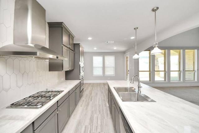 30702 Barred Owl Way, Brookshire, TX 77423 - kitchen featuring wall chimney exhaust hood, a sink, stainless steel appliances, tasteful backsplash, and recessed lighting