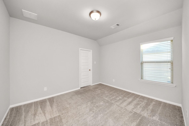 30702 Barred Owl Way, Brookshire, TX 77423 - empty room featuring carpet flooring, lofted ceiling, and baseboards