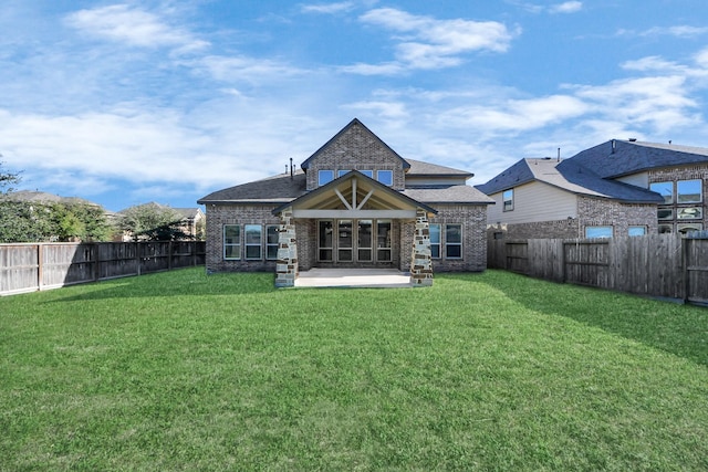 30702 Barred Owl Way, Brookshire, TX 77423 - rear view of house featuring brick siding and a patio area